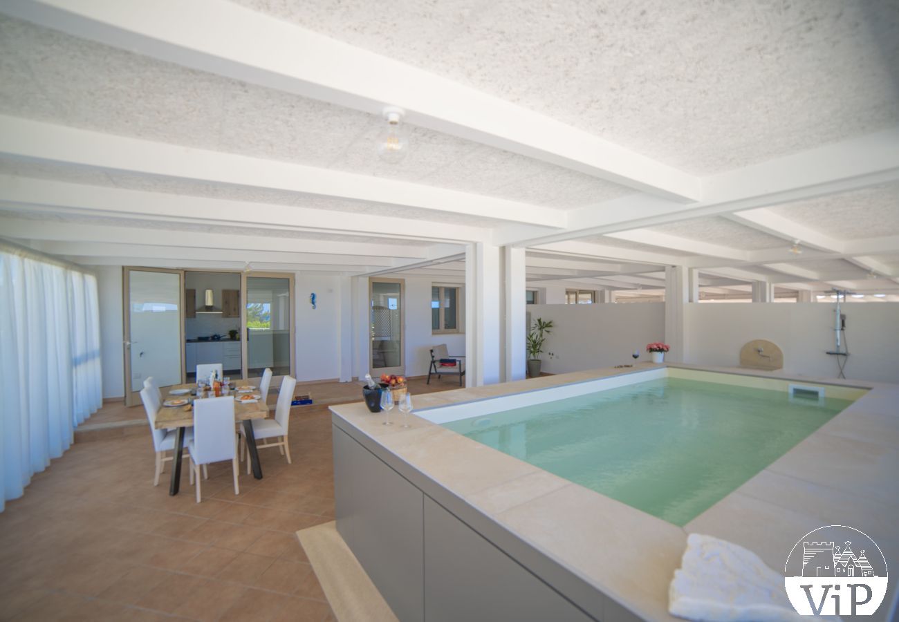 Appartement à Lido Marini - Maison piscine privée et vue mer climat WiFi m620