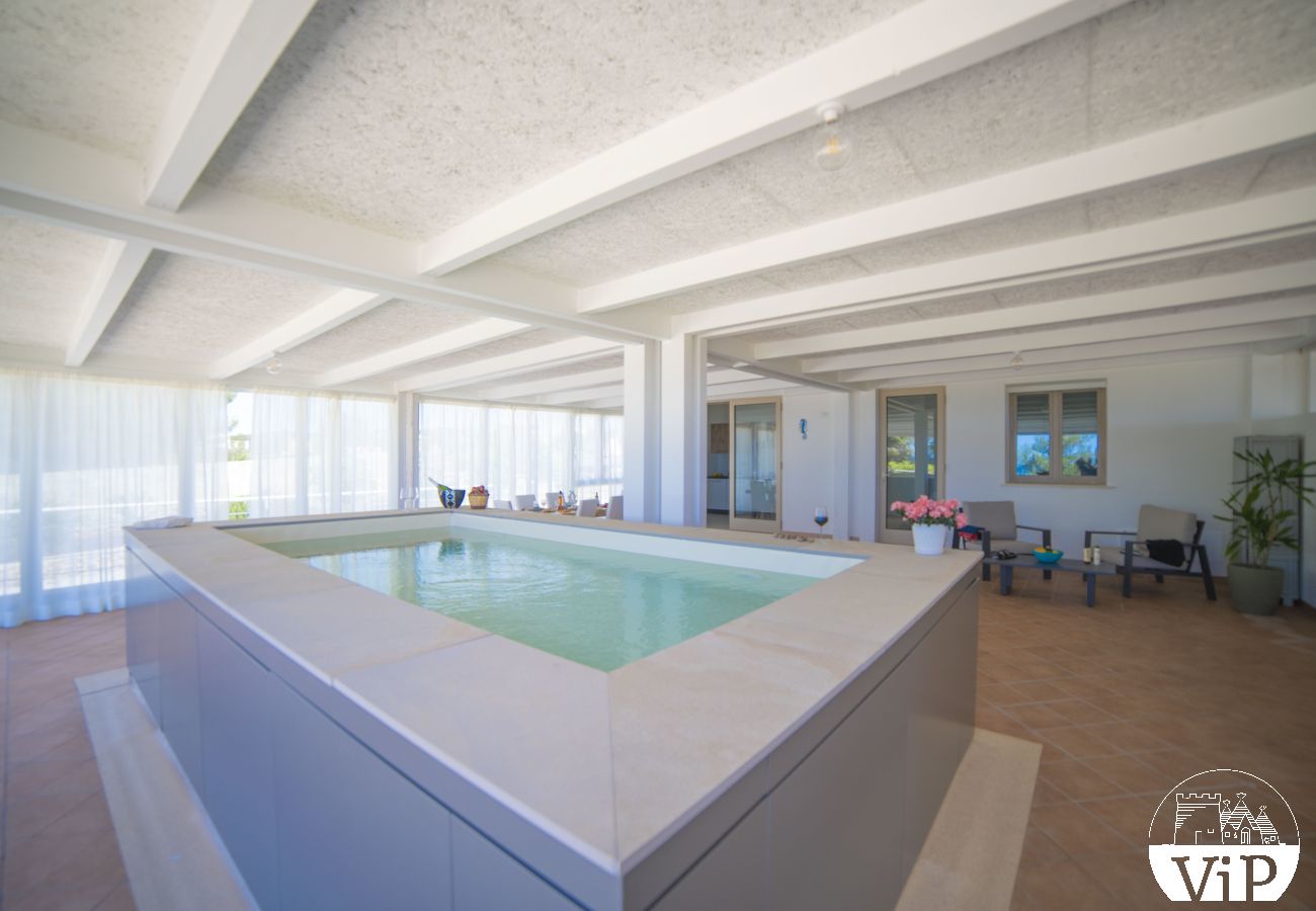 Appartement à Lido Marini - Maison piscine privée et vue mer climat WiFi m620