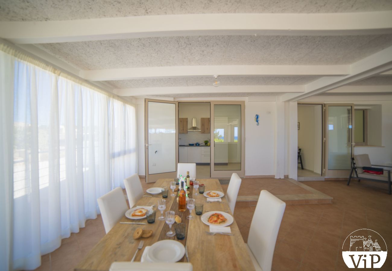 Appartement à Lido Marini - Maison piscine privée et vue mer climat WiFi m620