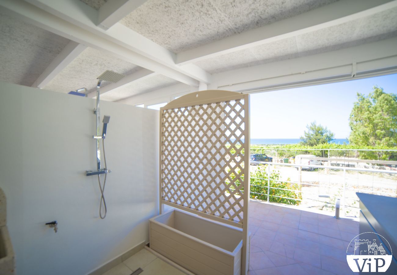 Appartement à Lido Marini - Maison piscine privée et vue mer climat WiFi m620