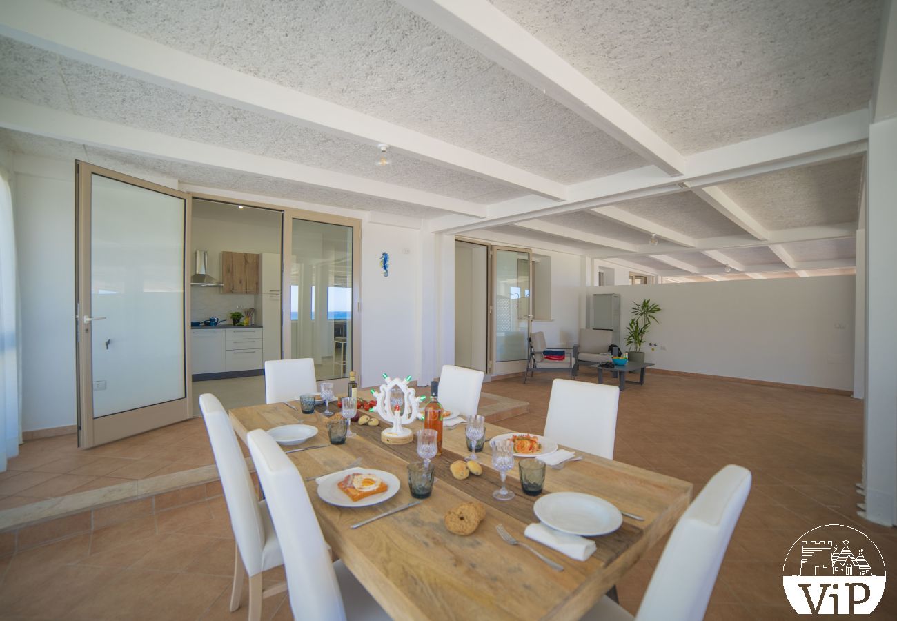 Appartement à Lido Marini - Maison piscine privée et vue mer climat WiFi m620